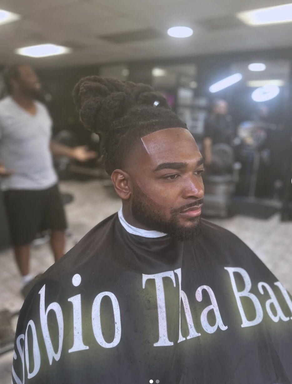Loc grooming with crisp line work by ScoobioThaBarber